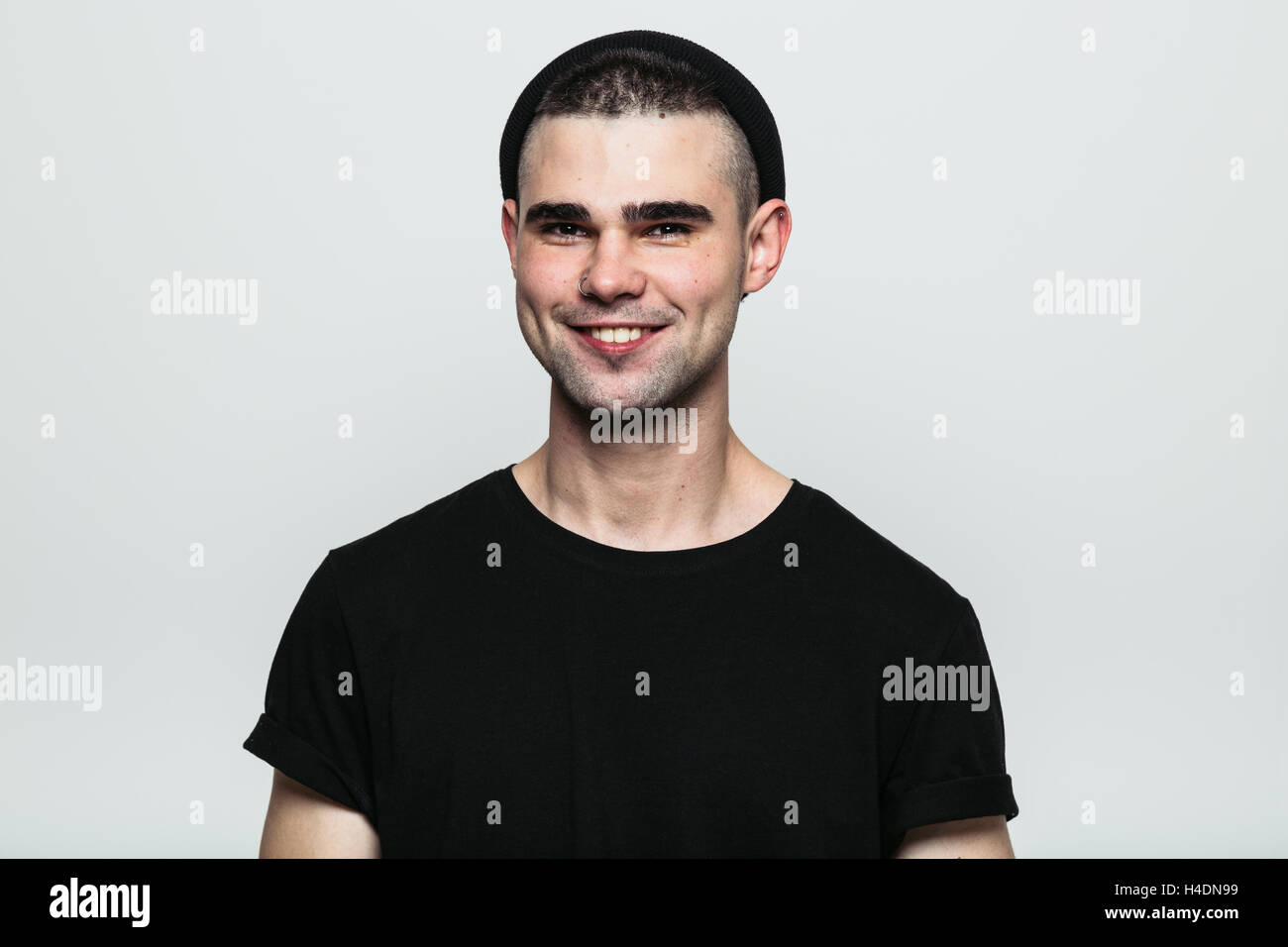 Portrait of young toothy smiling man Stock Photo