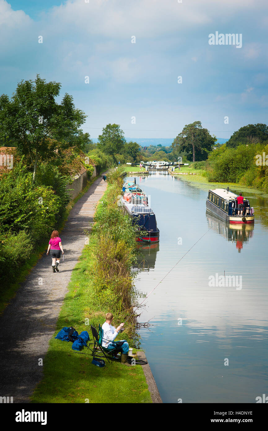 Angling and boating on the Kennet and Avon canal near Devizes Wiltshire UK Stock Photo