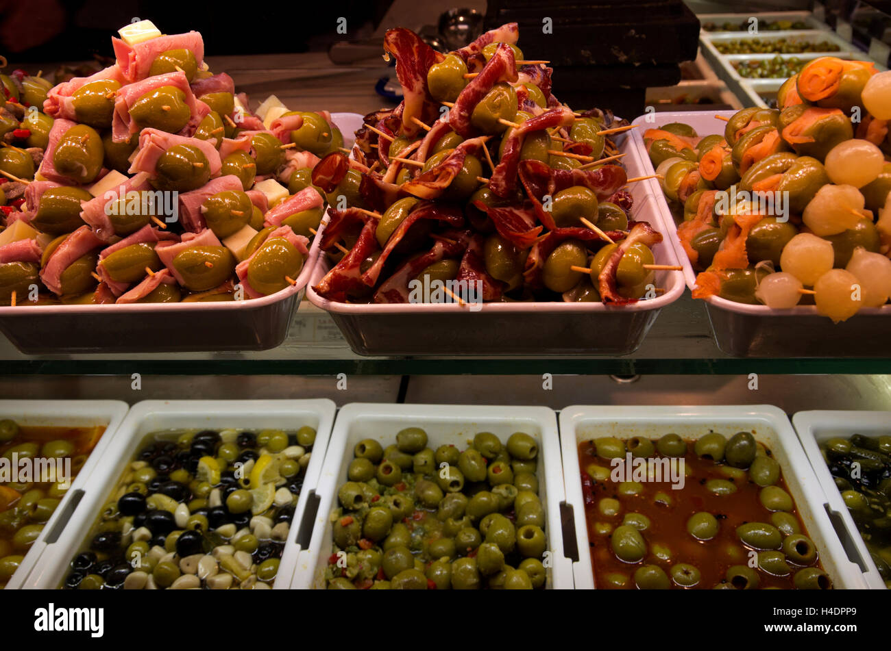 Display of a variety of olives, some stuffed with cheese, or ham. Stock Photo