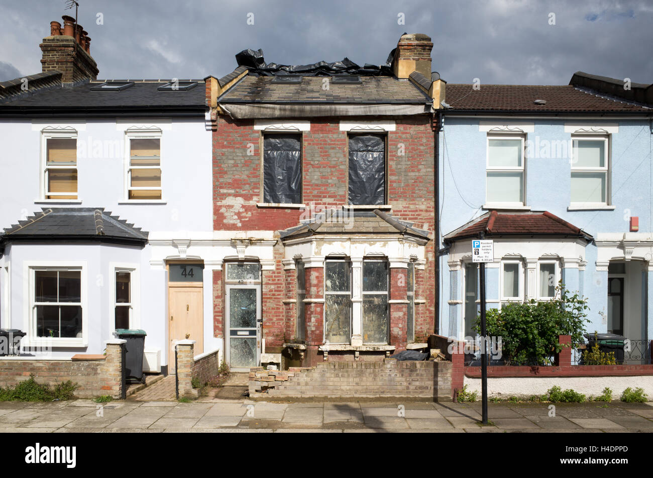 Terraced period house being refurbished in a street in Haringey, London, England, UK Stock Photo