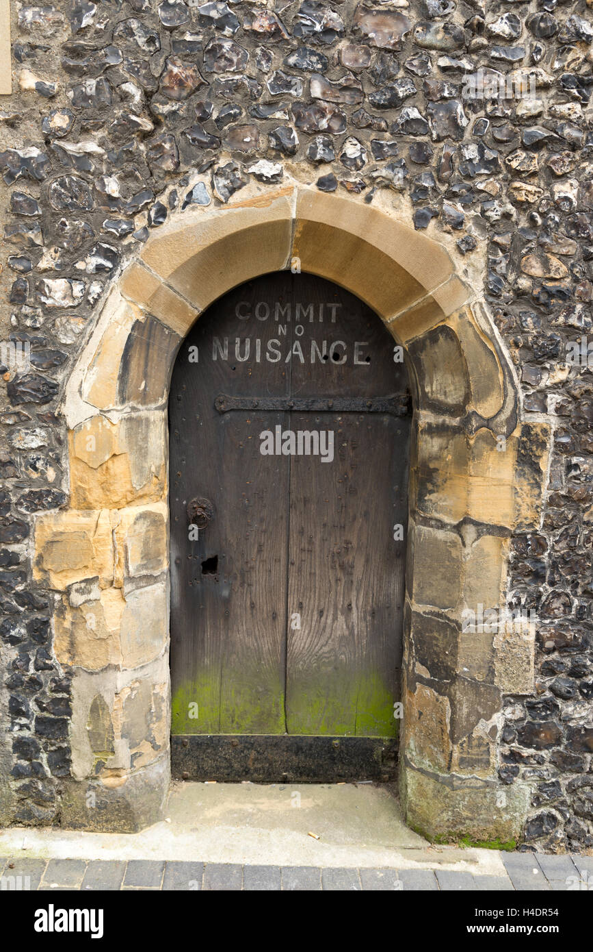 'Commit no Nuisance' sign on door to St Albans clock tower, Hertfordshire, England, UK Stock Photo