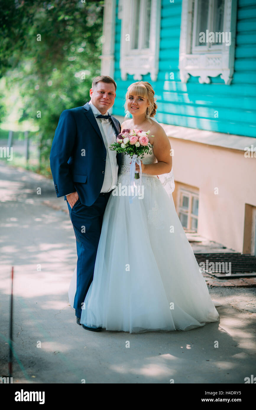 bride and groom on the background of the city Stock Photo - Alamy