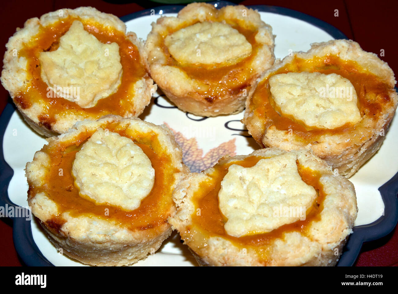 Flaky crust pumpkin tarts dessert plate Stock Photo