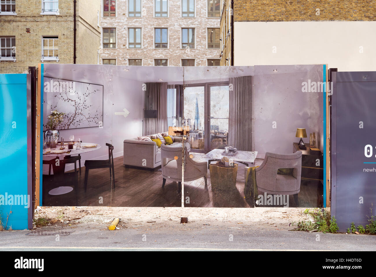 Hoarding showing the interior of new build apartments in a new property development in the City of London, England, UK Stock Photo