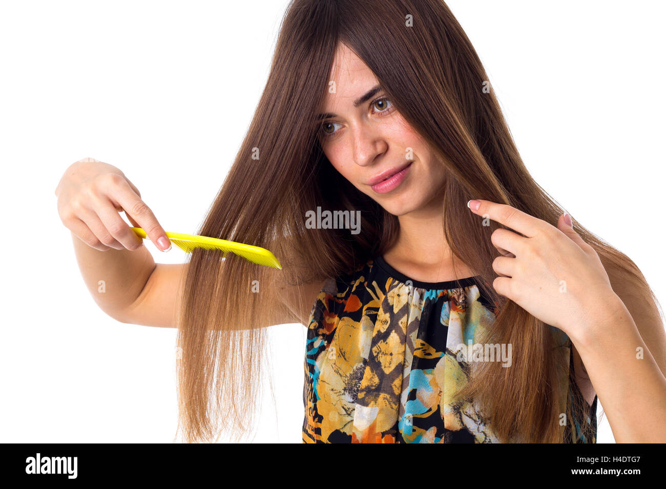 Young woman brushing her long hair Stock Photo - Alamy