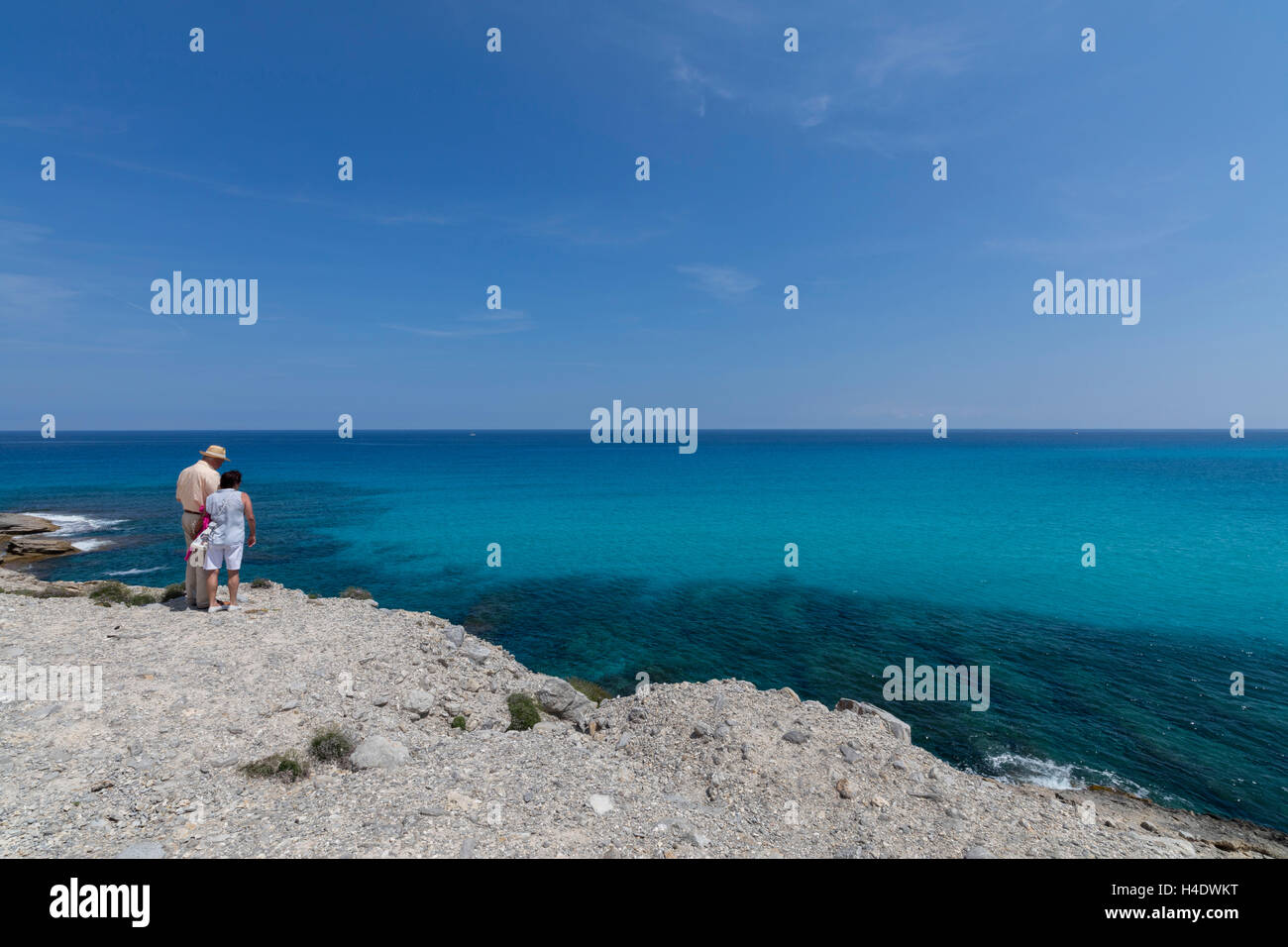 Spain, the Balearic Islands, island Majorca, Cala Mesquida, beach, tourist couple, thoughtful, sea view, Stock Photo