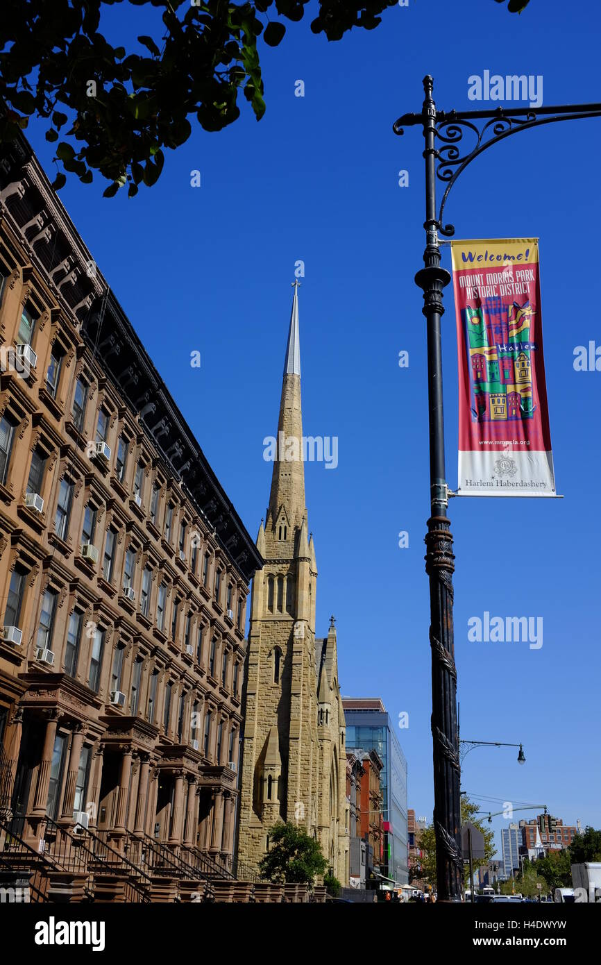 Brownstone apartment building on Lenox Avenue with Ephesus Church of