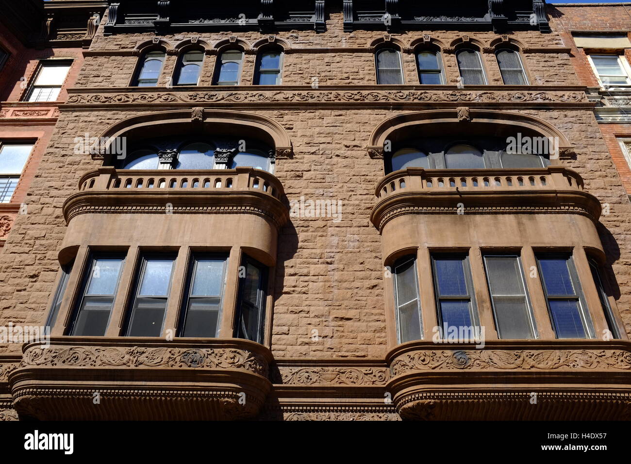 renovated historic apartment buildings along Malcolm X Boulevard in
