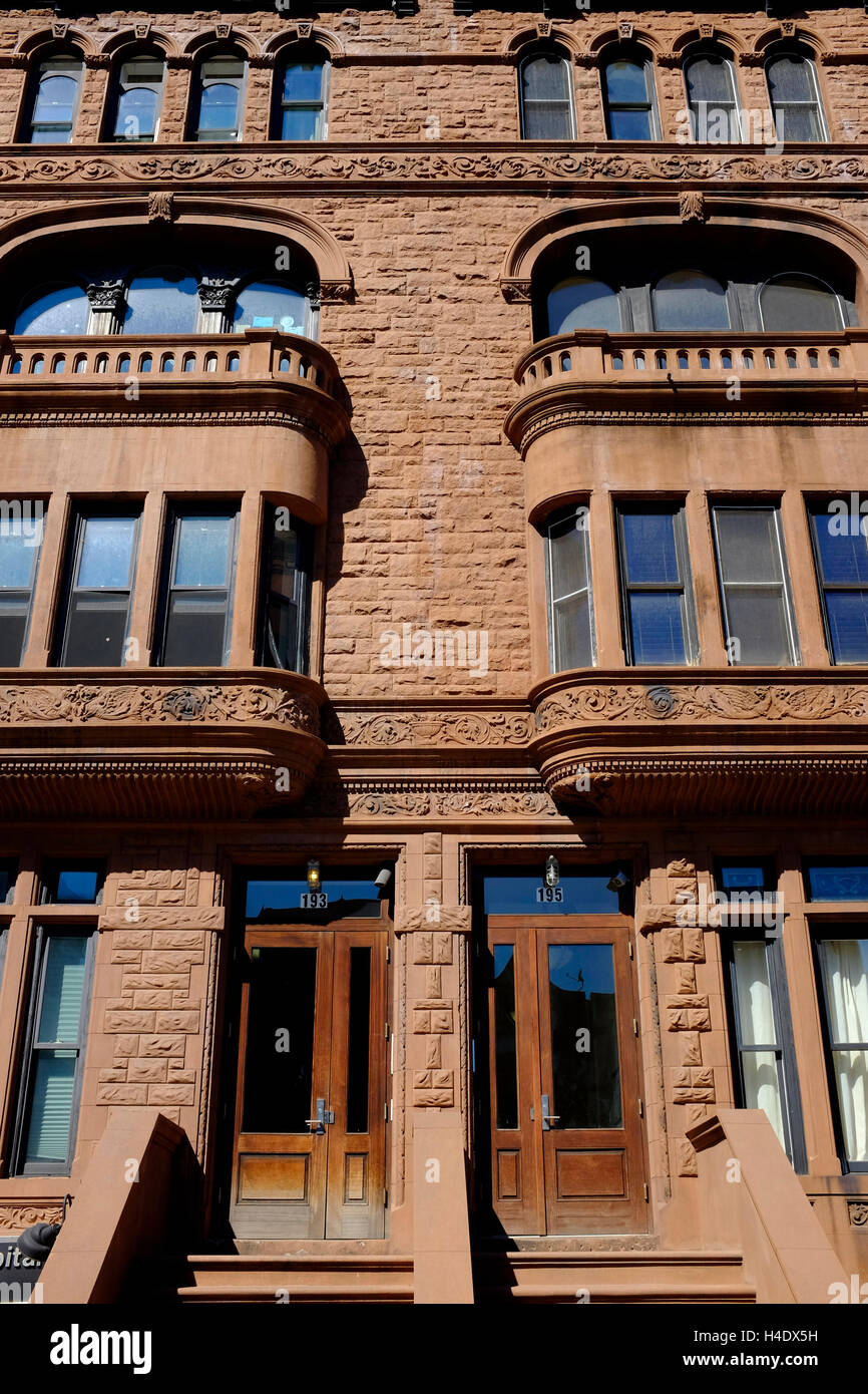 renovated historic apartment buildings along Malcolm X Boulevard in