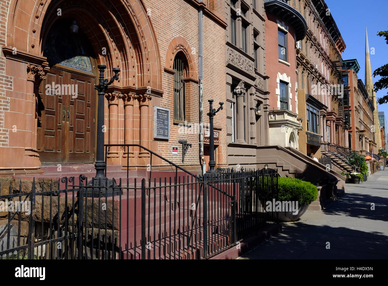 renovated historic apartment buildings along Malcolm X Boulevard in