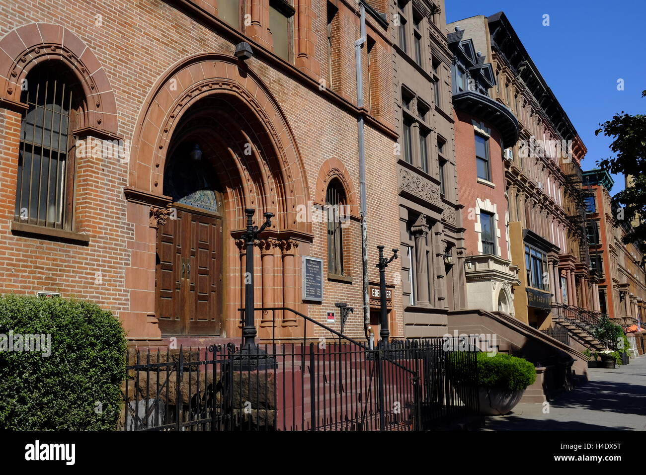 renovated historic apartment buildings along Malcolm X Boulevard in