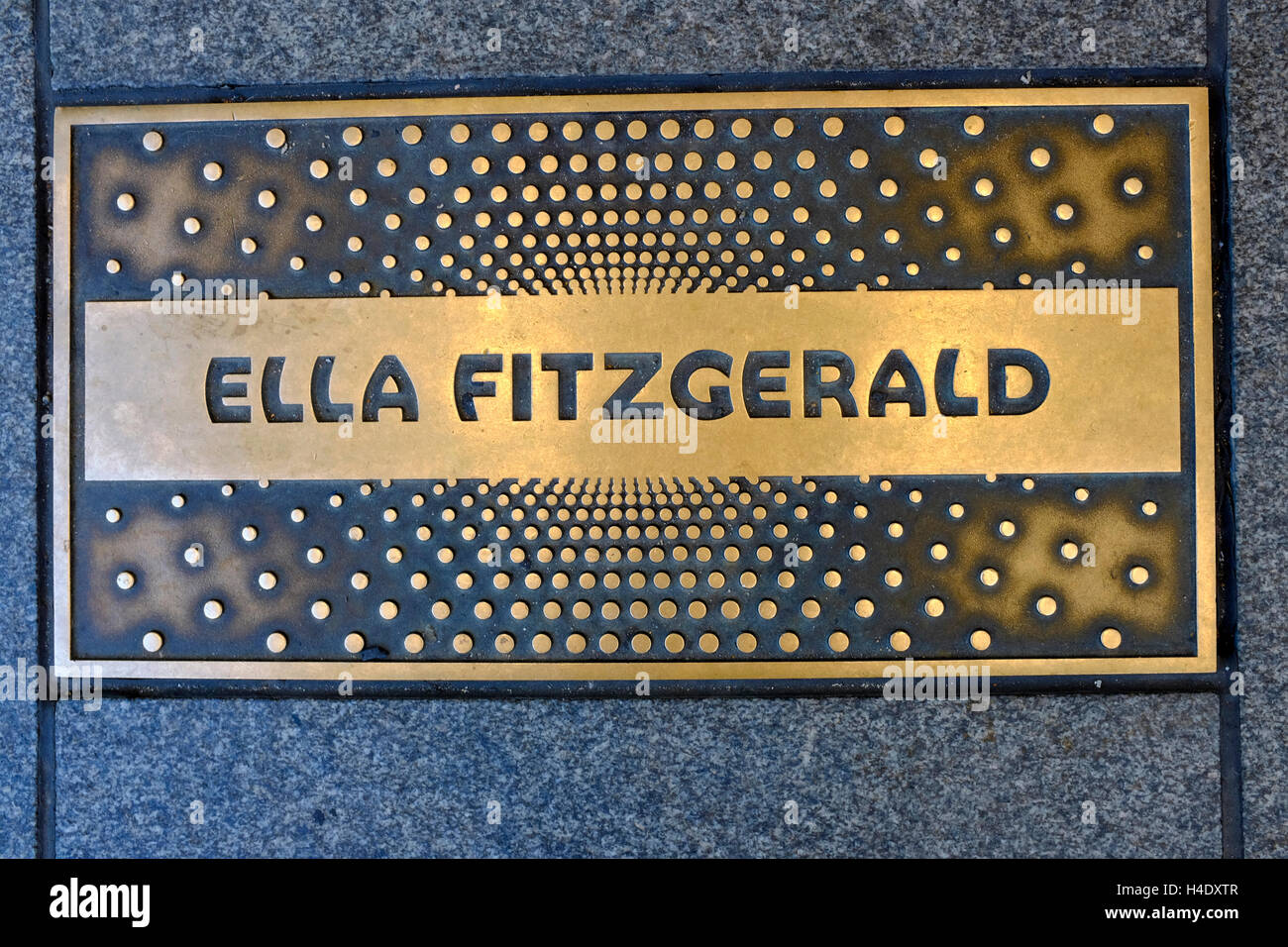 A closed up view of Ella Fitzgeralds' name plaques at Apollo theater's Walk of Fame.Harlem.New York City.USA Stock Photo