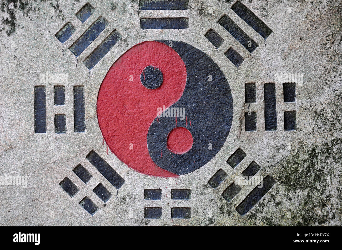 A black and red yin and yang symbol in important in Taosim on a wall Stock  Photo - Alamy