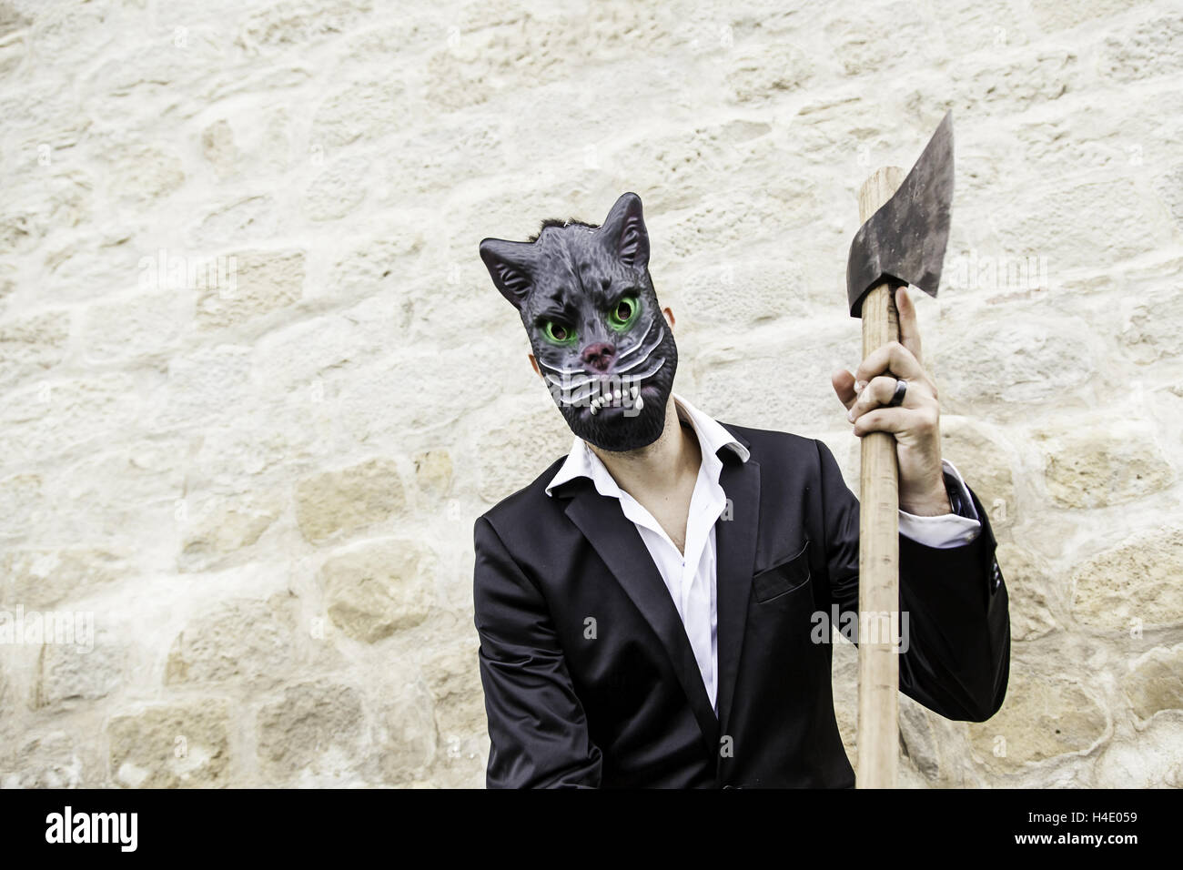 Murderers with masks and weapons, fear and violence Stock Photo