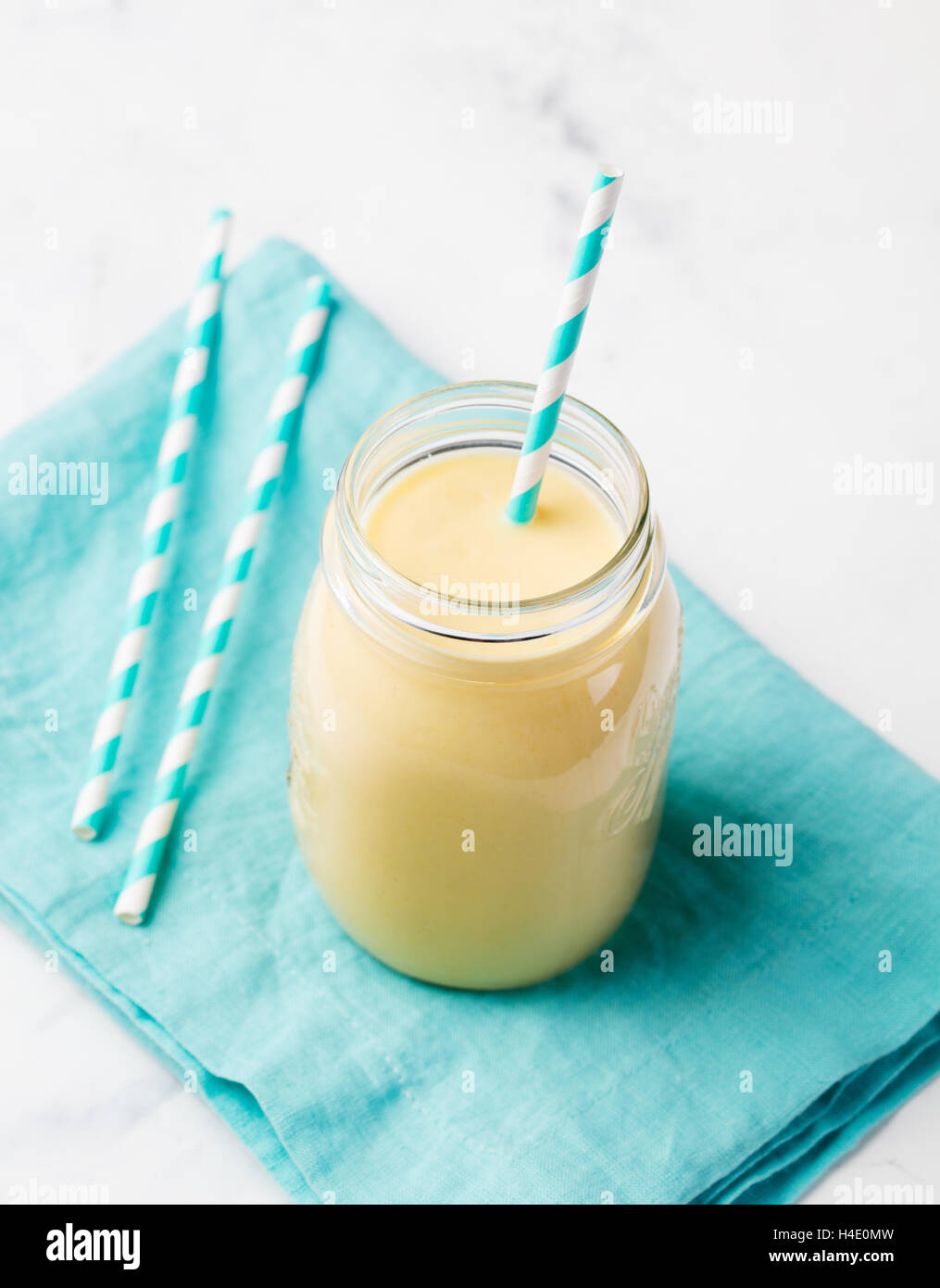 Mango Coconut yogurt smoothie in a glass jar Stock Photo Alamy