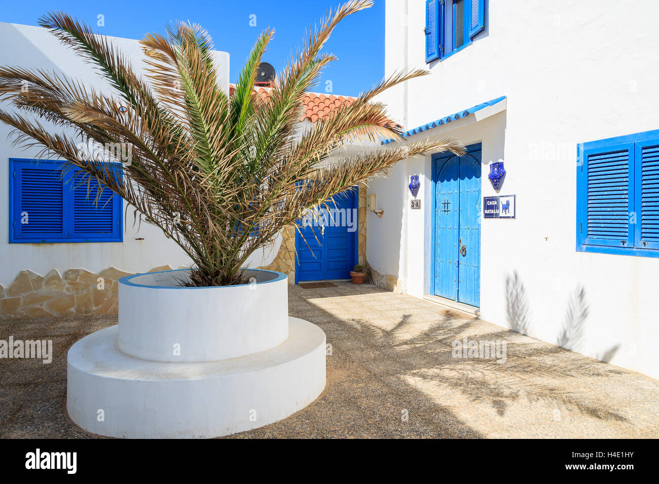 CORRALEJO, FUERTEVENTURA - FEB 5: typical holiday villa house with green window shutters and white walls in Corralejo town on 5th Feb 2014, Canary Islands, Spain Stock Photo