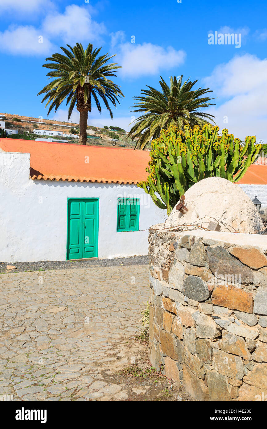 Traditional house built in Canary style in Betancuria village and paplm trees with stone wall, Fuerteventura, Canary Islands, Spain Stock Photo