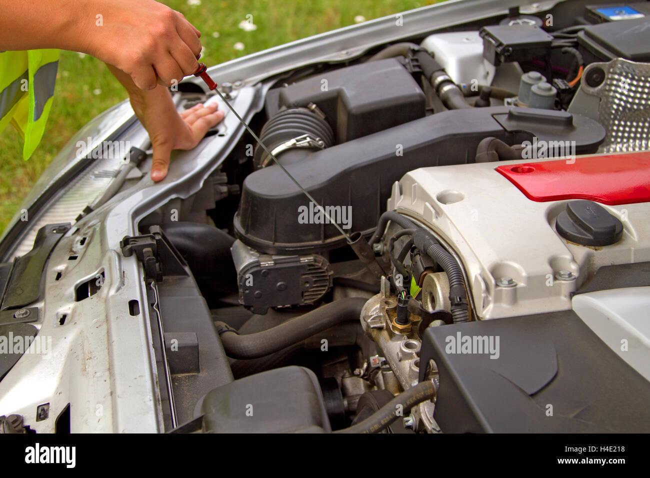 Details checking engine oil dipstick in car Stock Photo Alamy