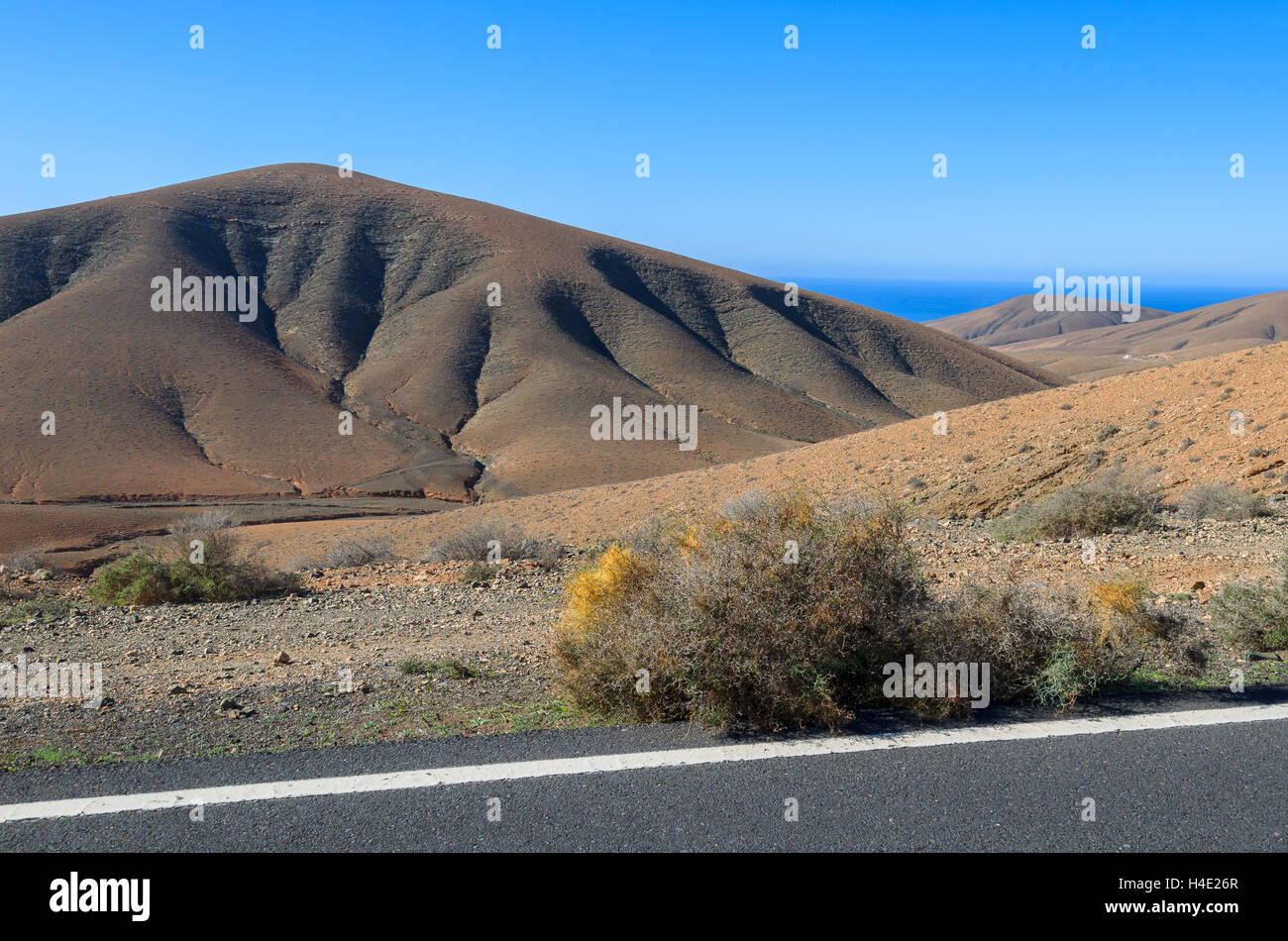Scenic mountain road with volcano view near Tuineje village, Fuerteventura, Canary Islands, Spain Stock Photo