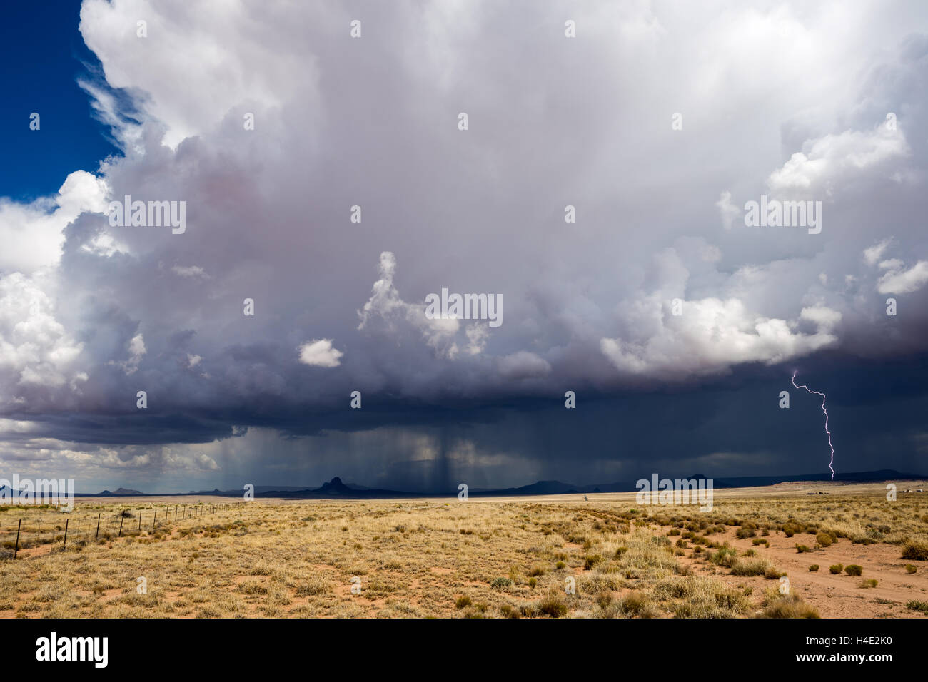 Powerful summer thunderstorm with dramatic cumulonimbus clouds moves across the desert northeast Arizona Stock Photo