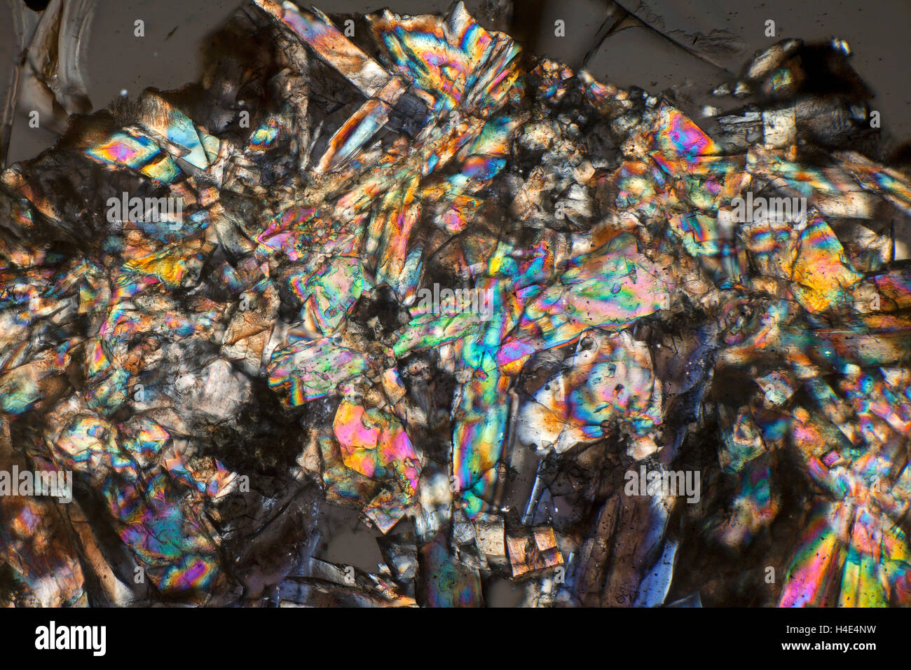 Cross polarized photomicrograph of sinter deposits from a kiln. Stock Photo