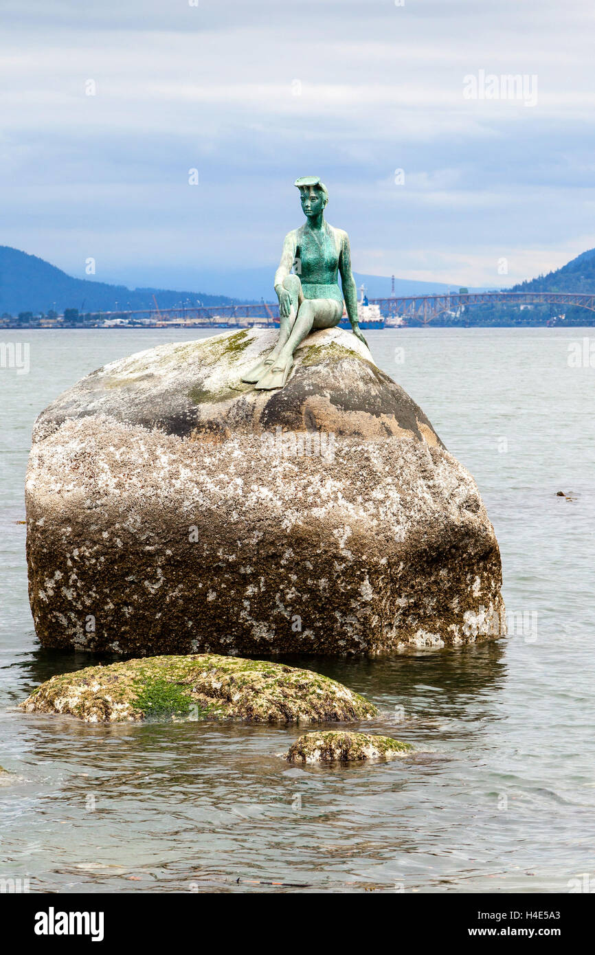 Girl in Wetsuit statue at Stanley Park, Vancouver. The statue represents Vancouver's dependence on the sea. Stock Photo