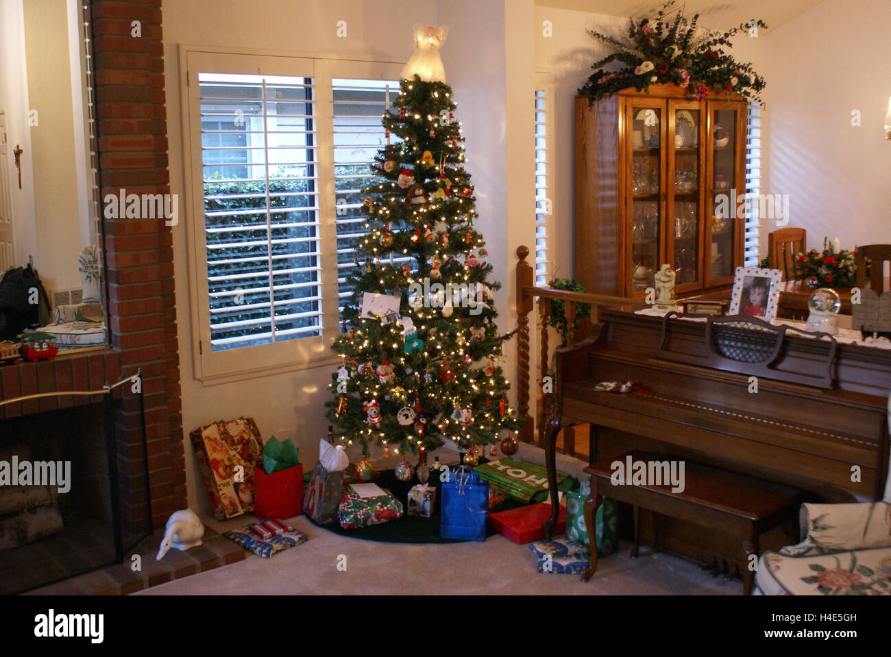Christmas Tree with a white angel on top Stock Photo Alamy