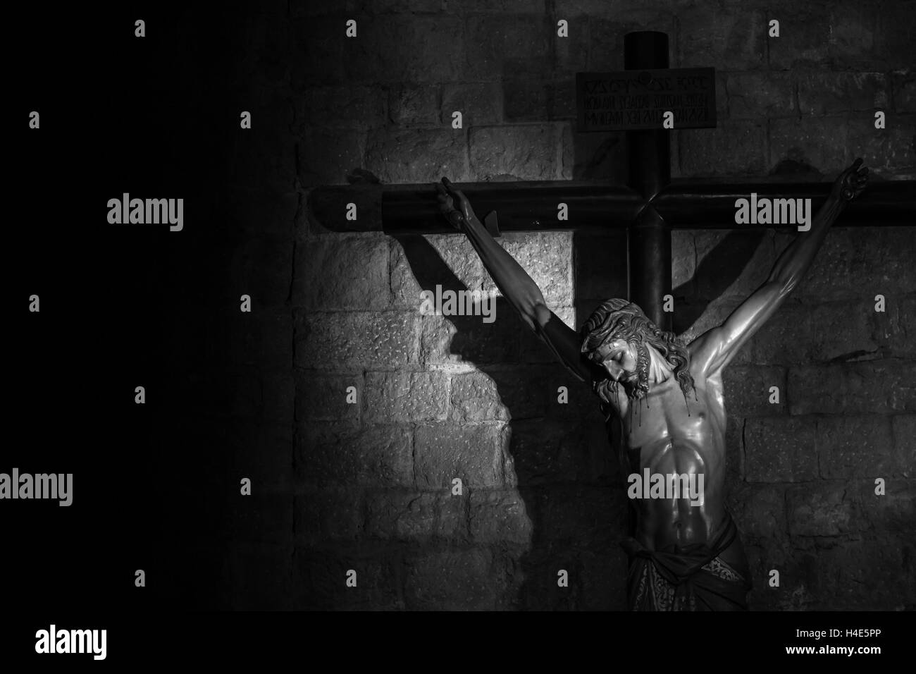 Old medieval crucifix in Italian church - made of wood Stock Photo