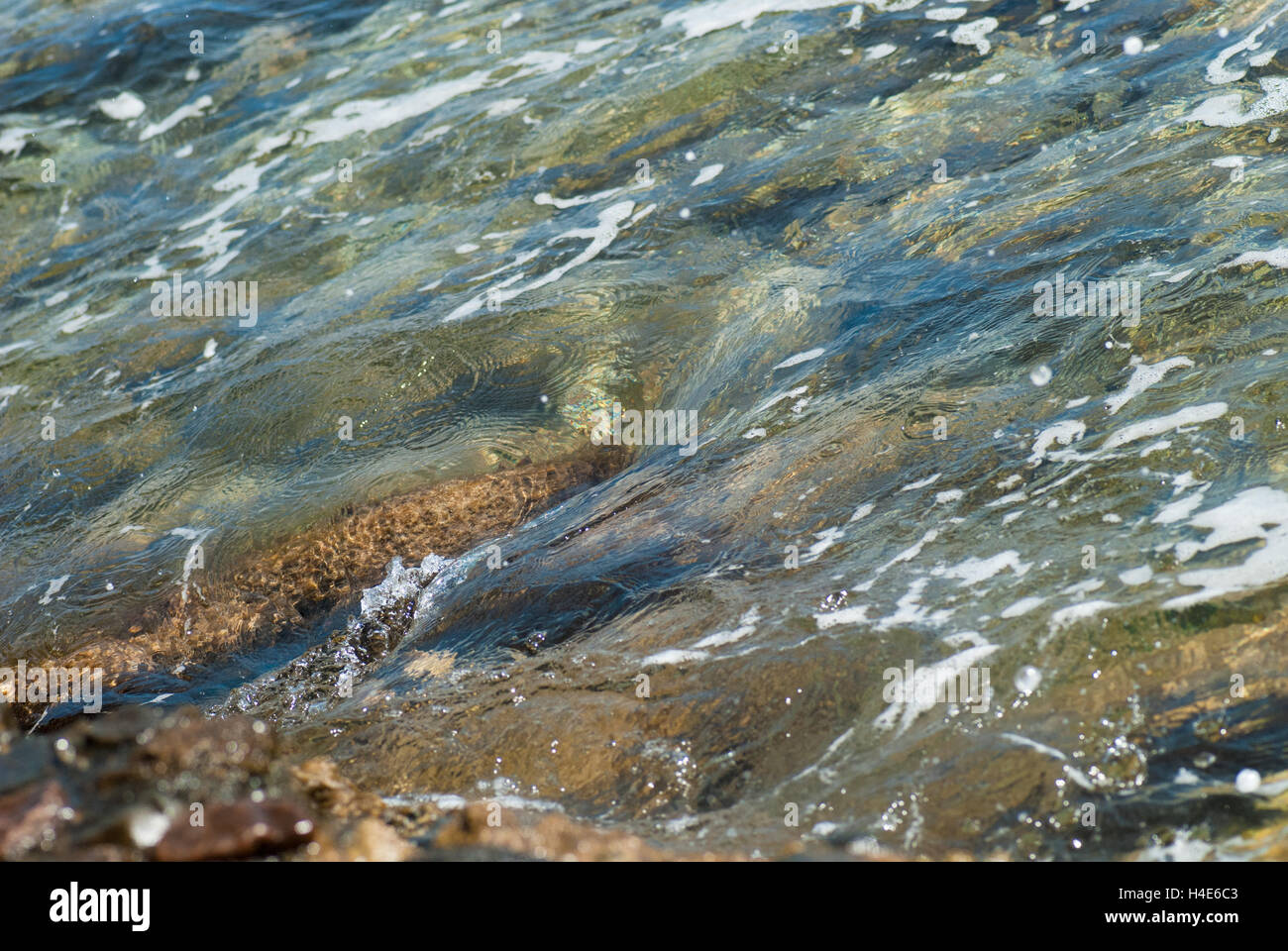 Photo of beautiful clear turquoise sea ocean water surface with ripples ...