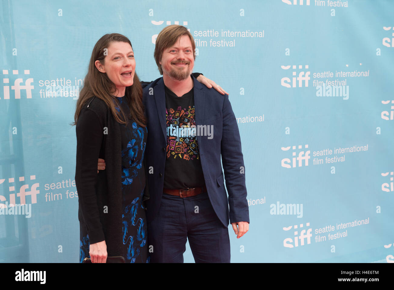 Linas Phillips (r), director of Rainbow Time, and girlfriend attend the Seattle International Film Festival (SIFF) red carpet opening night gala on May 19, 2016 in Seattle, Washington. Stock Photo