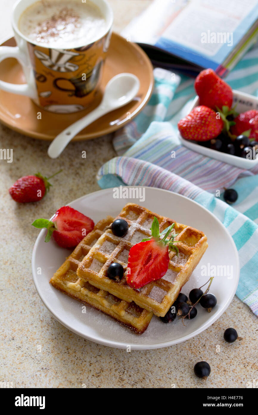 Traditional Belgian waffles with cream whipped cream and fresh berries ...