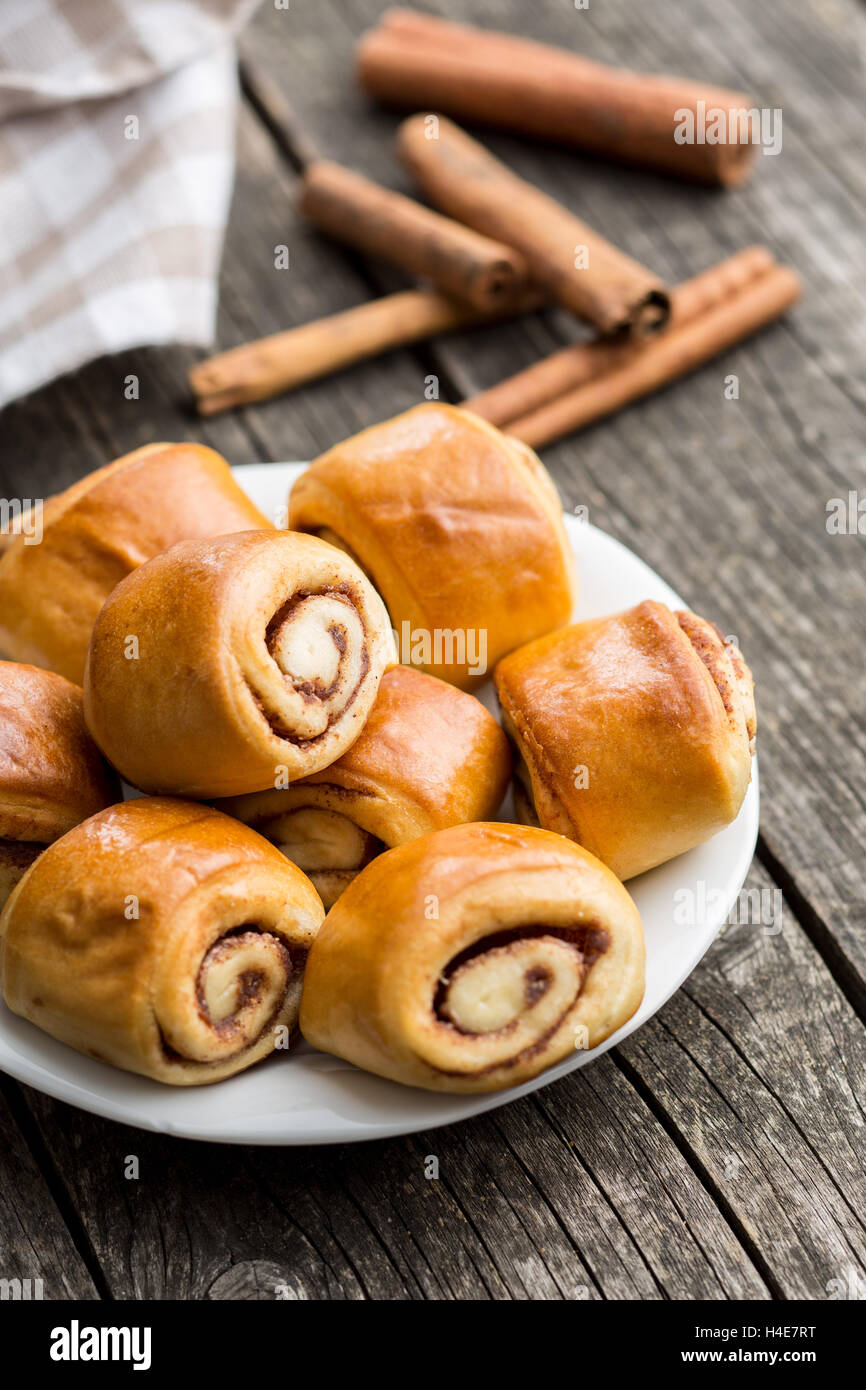 Mini cinnamon buns on plate. Stock Photo