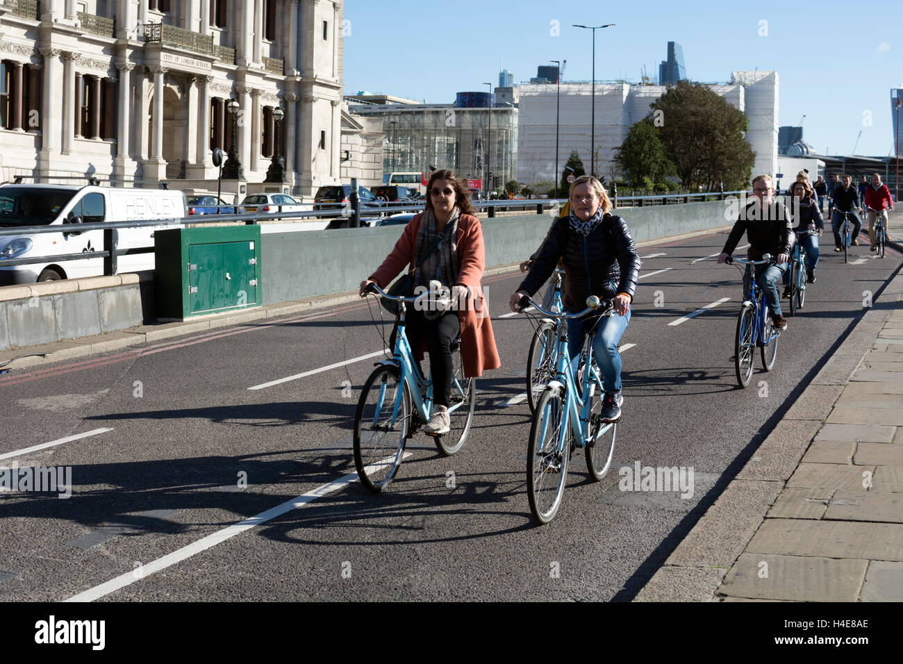 People cycling along Victoria Embankment, London, UK Stock Photo