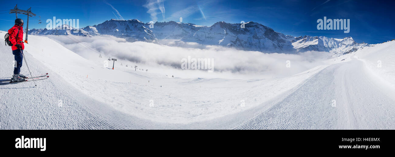 Young man ready to skiing in Swiss Alps mountain ski resort, Elm, Switzerland Stock Photo
