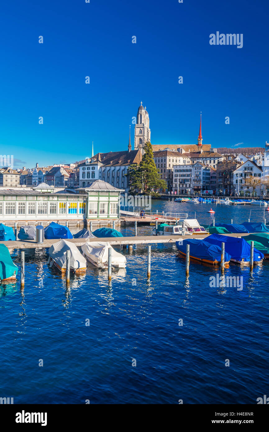Historic Zurich city center with famous Grossmunster Church and Limmat river Stock Photo