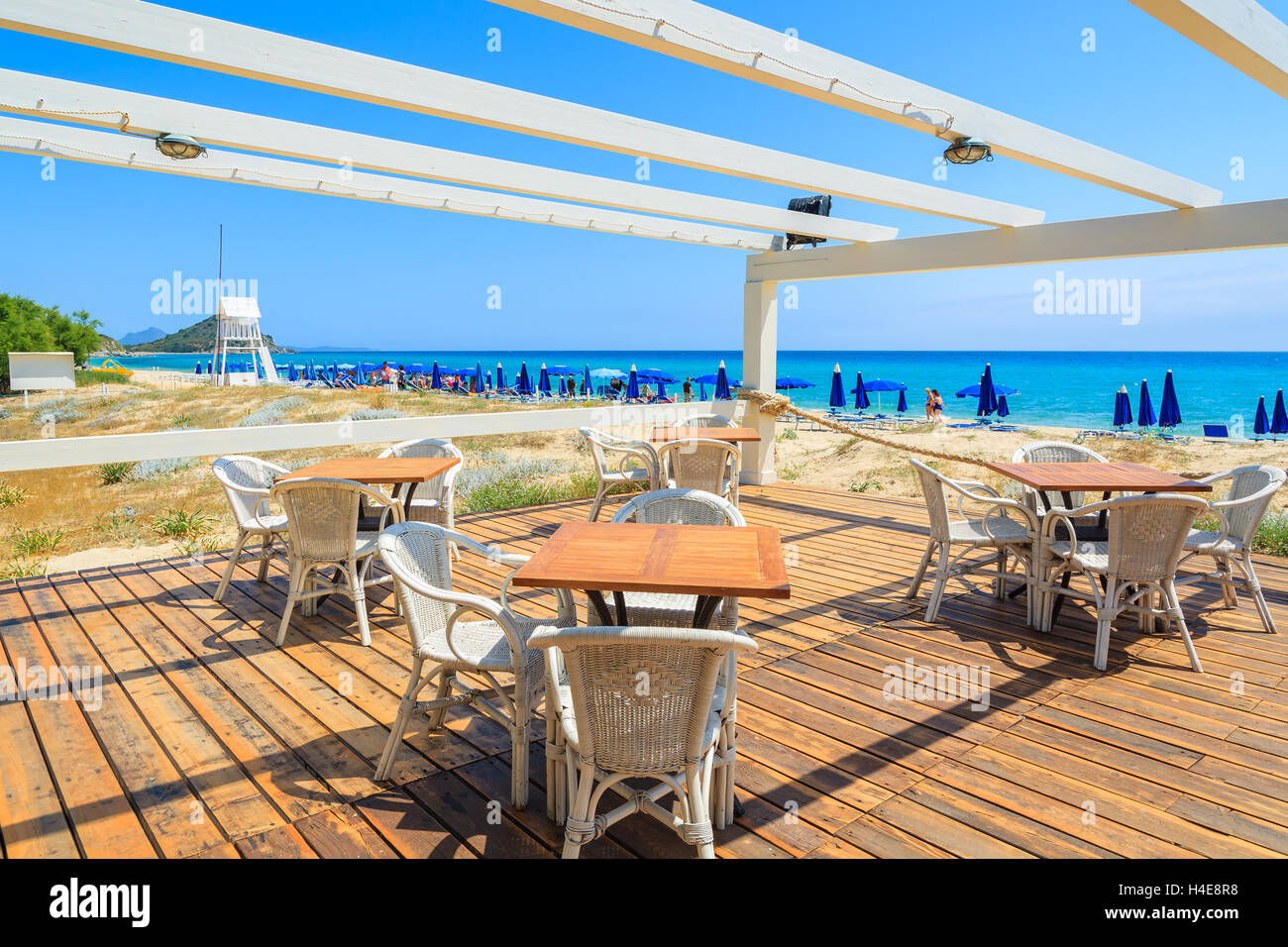 Beach restaurant in Cala Sinzias on sunny summer day, Sardinia island, Italy Stock Photo