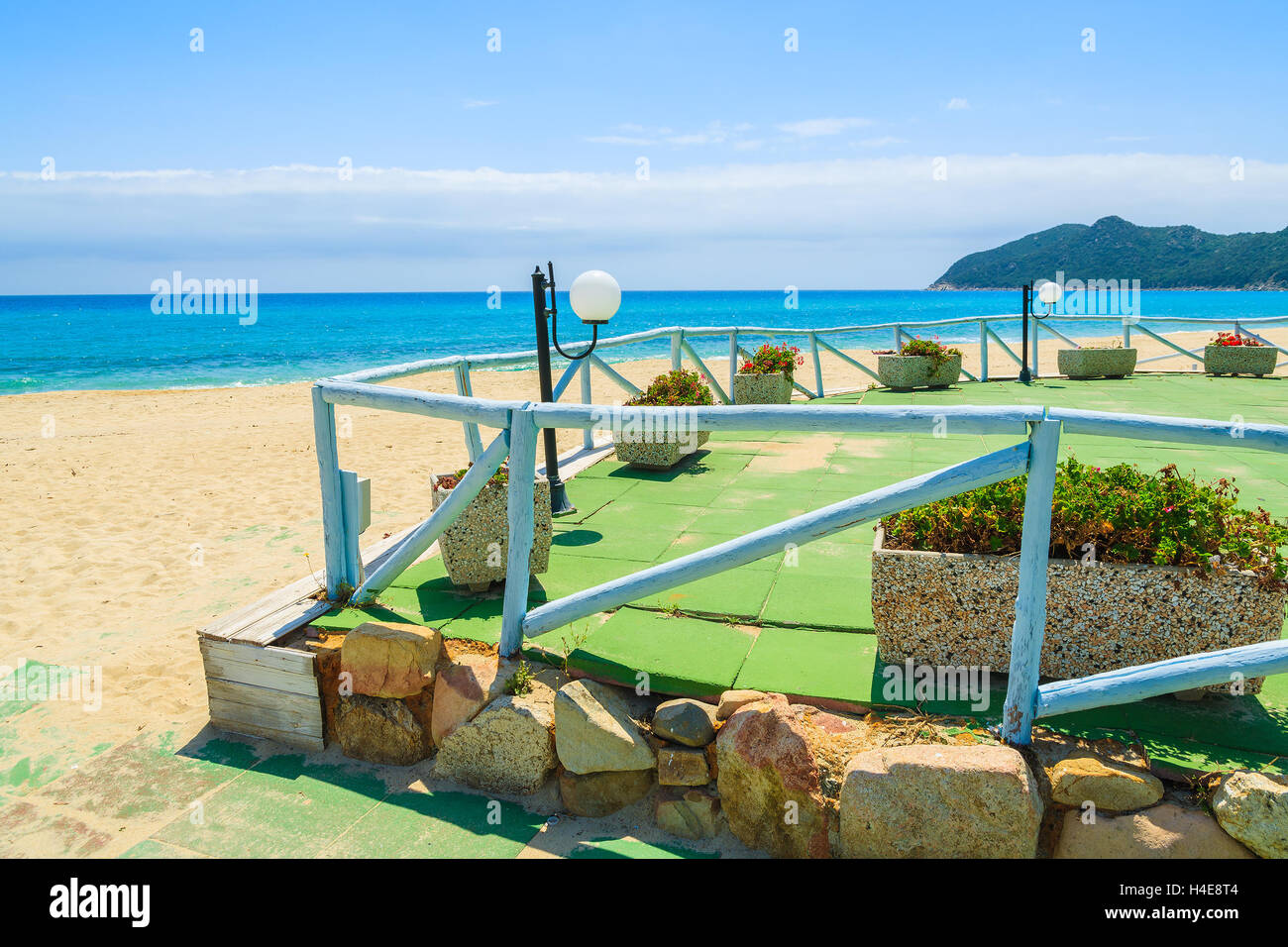 Terrace of beach bar in Cala Sinzias on sunny summer day, Sardinia island, Italy Stock Photo