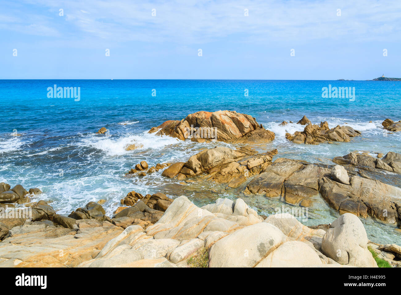 Rocks in sea on sunny summer day, Porto Giunco bay, Sardinia island, Italy Stock Photo
