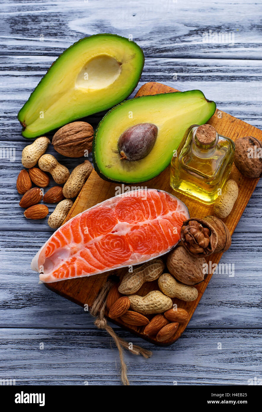 Healthy fat salmon, avocado, oil, nuts. Selective focus Stock Photo