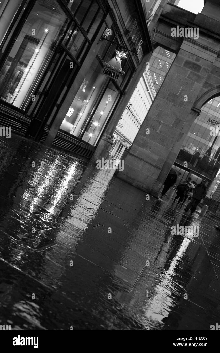Street Photography, Reflections on Wet Ground Stock Photo