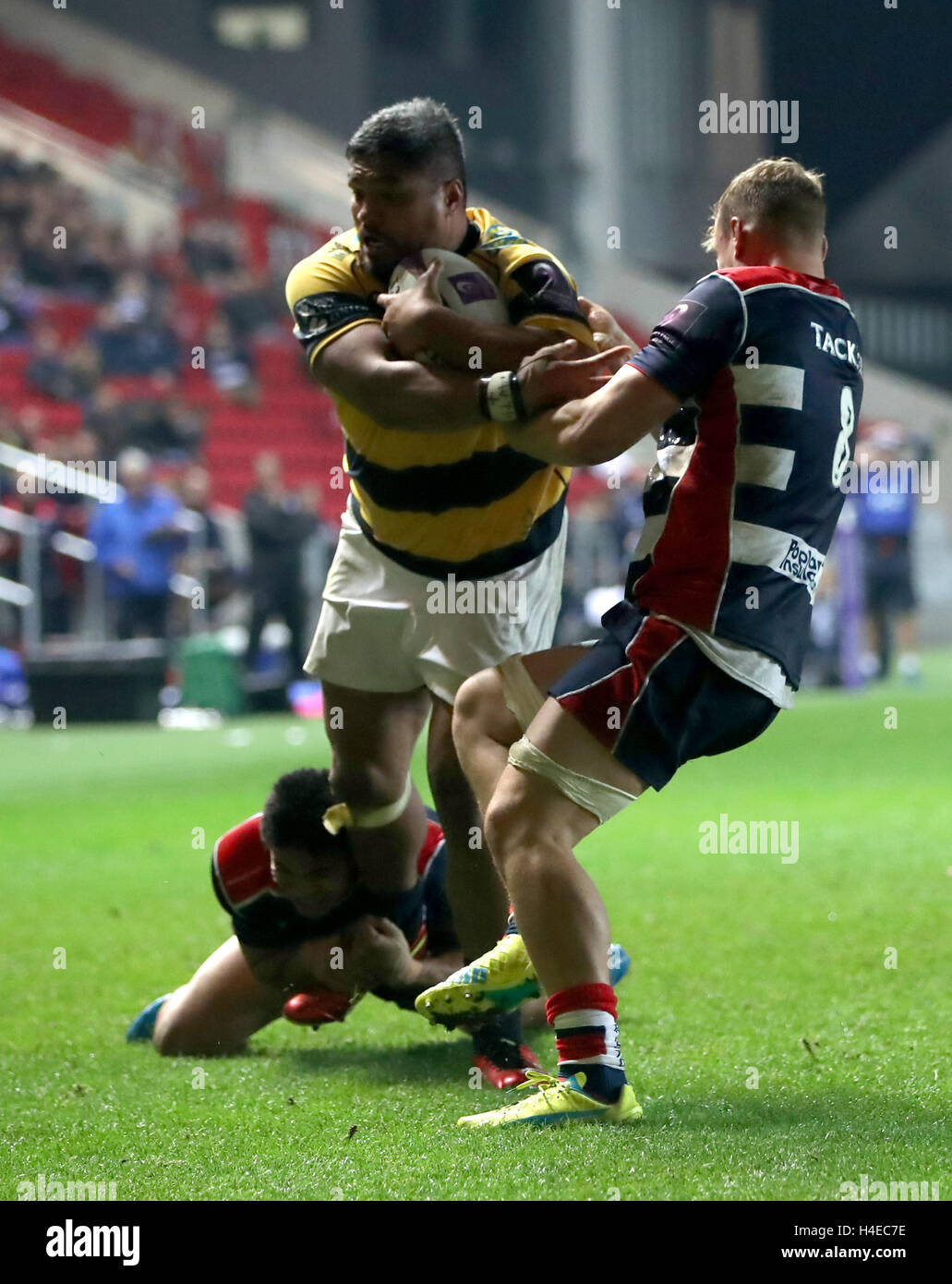 Cardiff Blue's Nick Williams is tackeled by Bristol Rugby's David Lemi ...