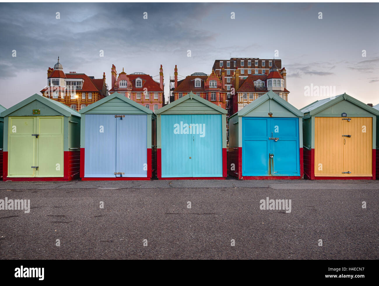 Colourful beach huts on the promenade at Hove Gardens, East Sussex