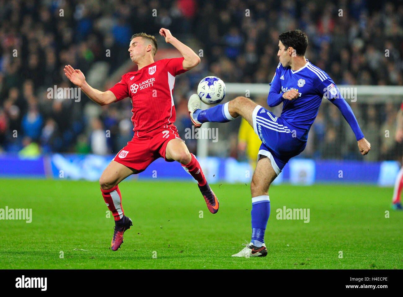 Cardiff City's Peter Whittingham and Bristol City's Joy Bryan in action during the Sky Bet Championship match at The Cardiff City Stadium. PRESS ASSOCIATION Photo. Picture date: Friday October 14, 2016. See PA story SOCCER Cardiff. Photo credit should read: Simon Galloway/PA Wire. RESTRICTIONS: No use with unauthorised audio, video, data, fixture lists, club/league logos or 'live' services. Online in-match use limited to 75 images, no video emulation. No use in betting, games or single club/league/player publications. Stock Photo