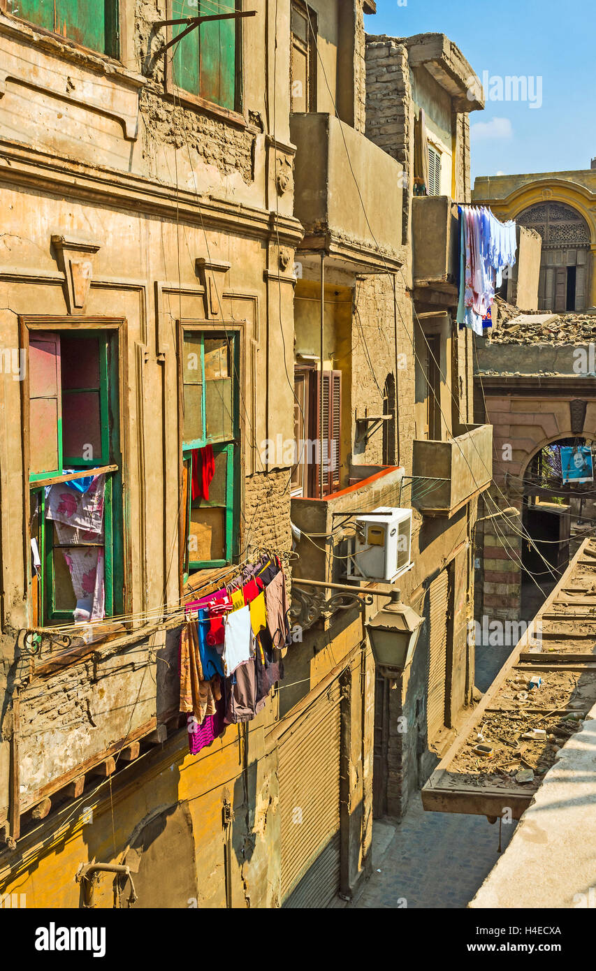 The  narrow lane with the old houses is branched from Al-Muizz street, Cairo Egypt Stock Photo