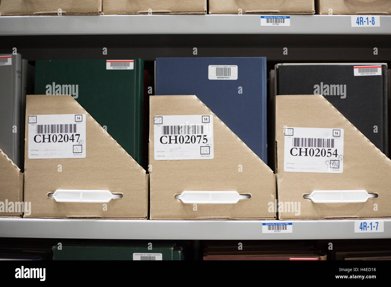 Books on a shelf in a high density library, an off-site environmentally controlled storage and preservation facility for university references. Stock Photo