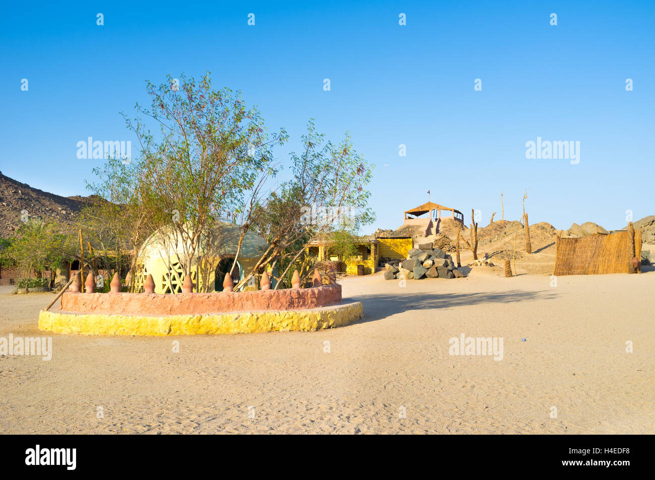 The old draw-well, surrounded by bushes is the central and the most important building in the Bedouin village, Egypt. Stock Photo