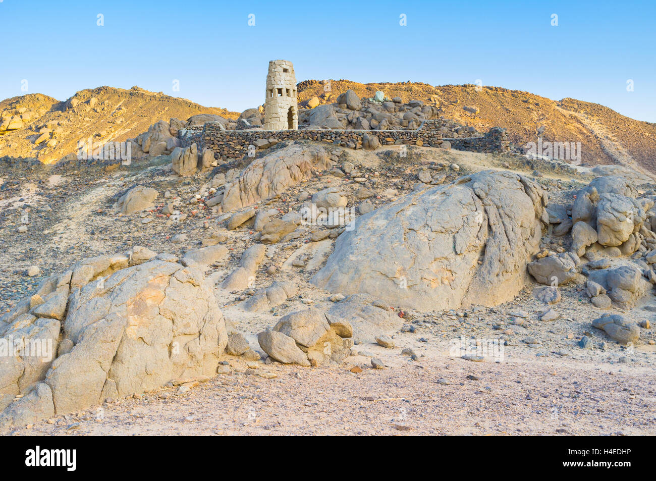 The small Bedouin village surrounded by rocky hills, Sahara, Egypt. Stock Photo