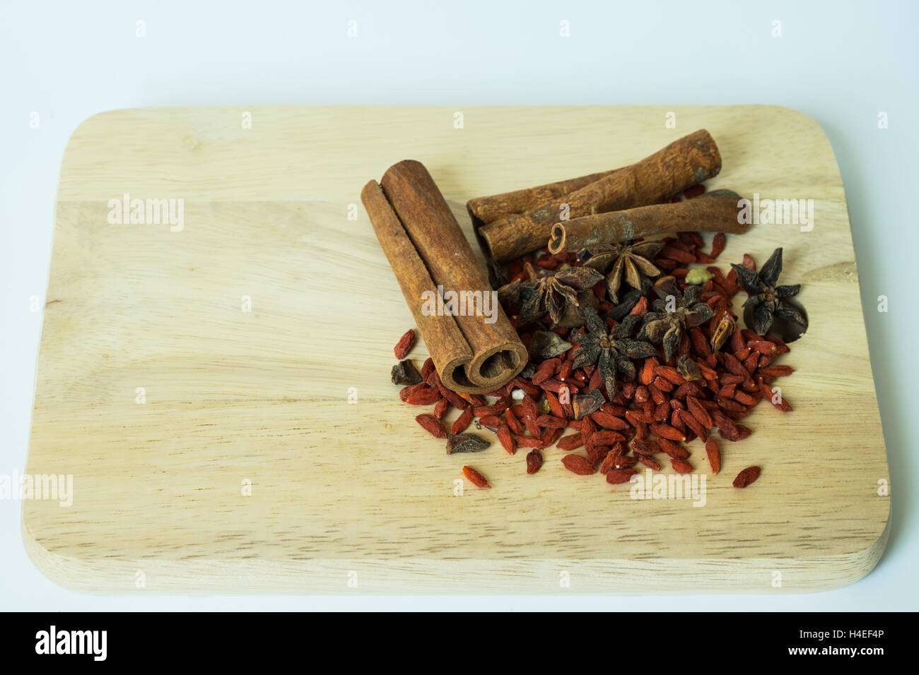 Traditional chinese dried herbs on a wooden chopping board Stock Photo