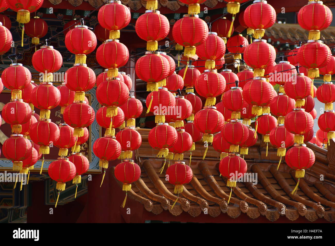 red Chinese lanterns hanging at a temple Stock Photo - Alamy