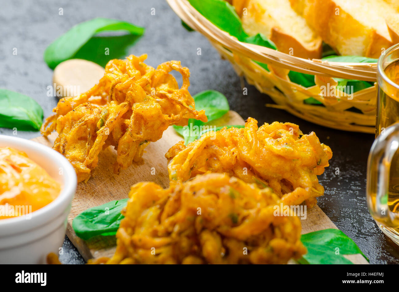 Indian spicy onion bhajis dipping sauce hires stock photography and